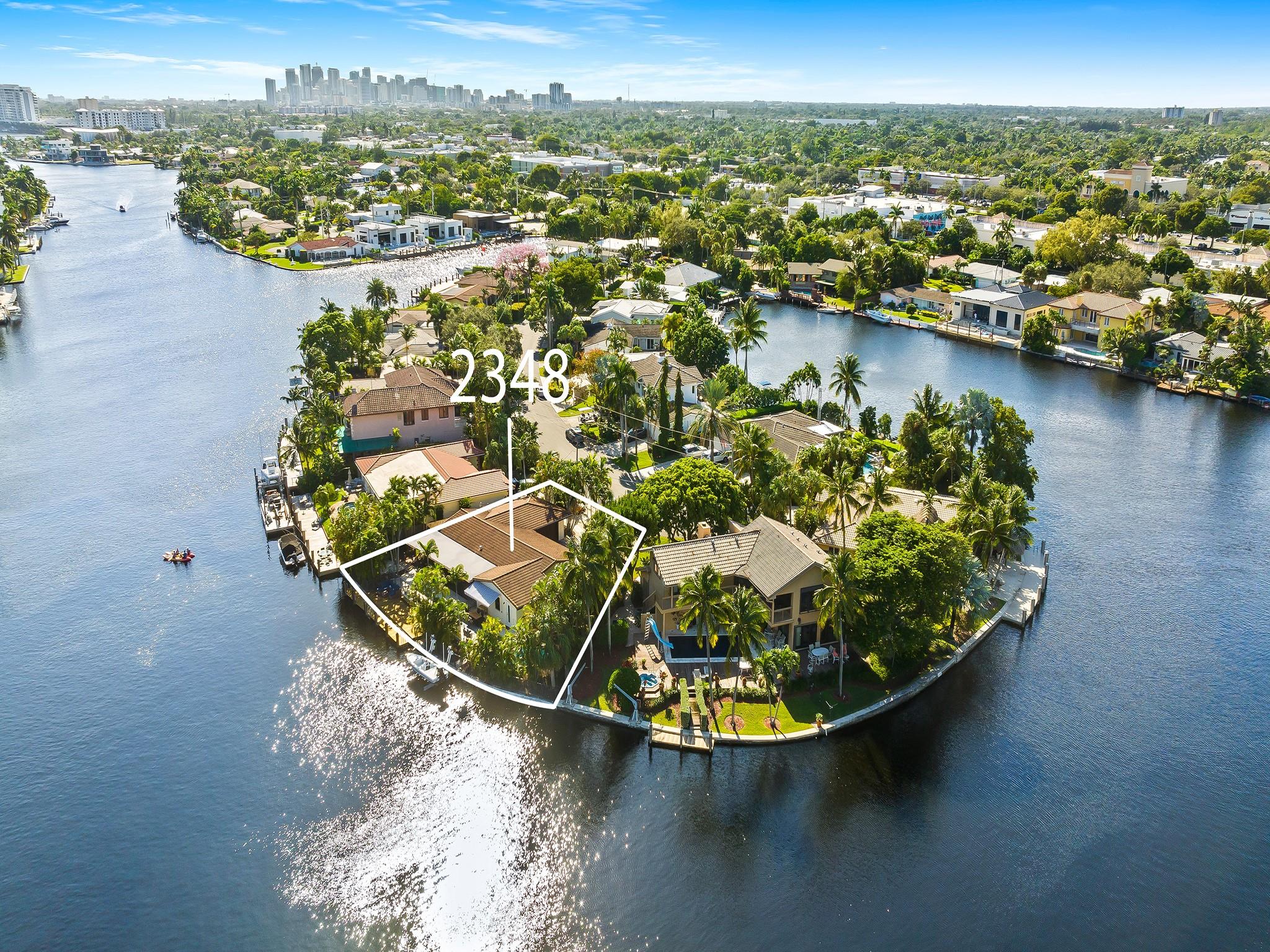 Tropical waterfront retreat boasting 130 ft of prime water frontage with breathtaking panoramic wide waterway views. This updated residence is at the end of a cul-de-sac with a driveway for 8 cars & an oversized 2 car garage. The spacious & bright open floor plan blends multiple entertaining areas accentuated with walls of glass doors that blend indoor & outdoor living spaces. The enormous screened in lanai features an outside living room & dining area. Lush foliage frames the large back patio, pool/spa, gas BBQ area & large side yard. The open kitchen with a 6 burner gas cook top/gas stove & upgraded appliances will inspire the avid chef. The waterside primary suite features 2 closets, a cabana bath & access to the lanai. Minutes to shopping, restaurants, gyms & more. Sq Ft from Seller.