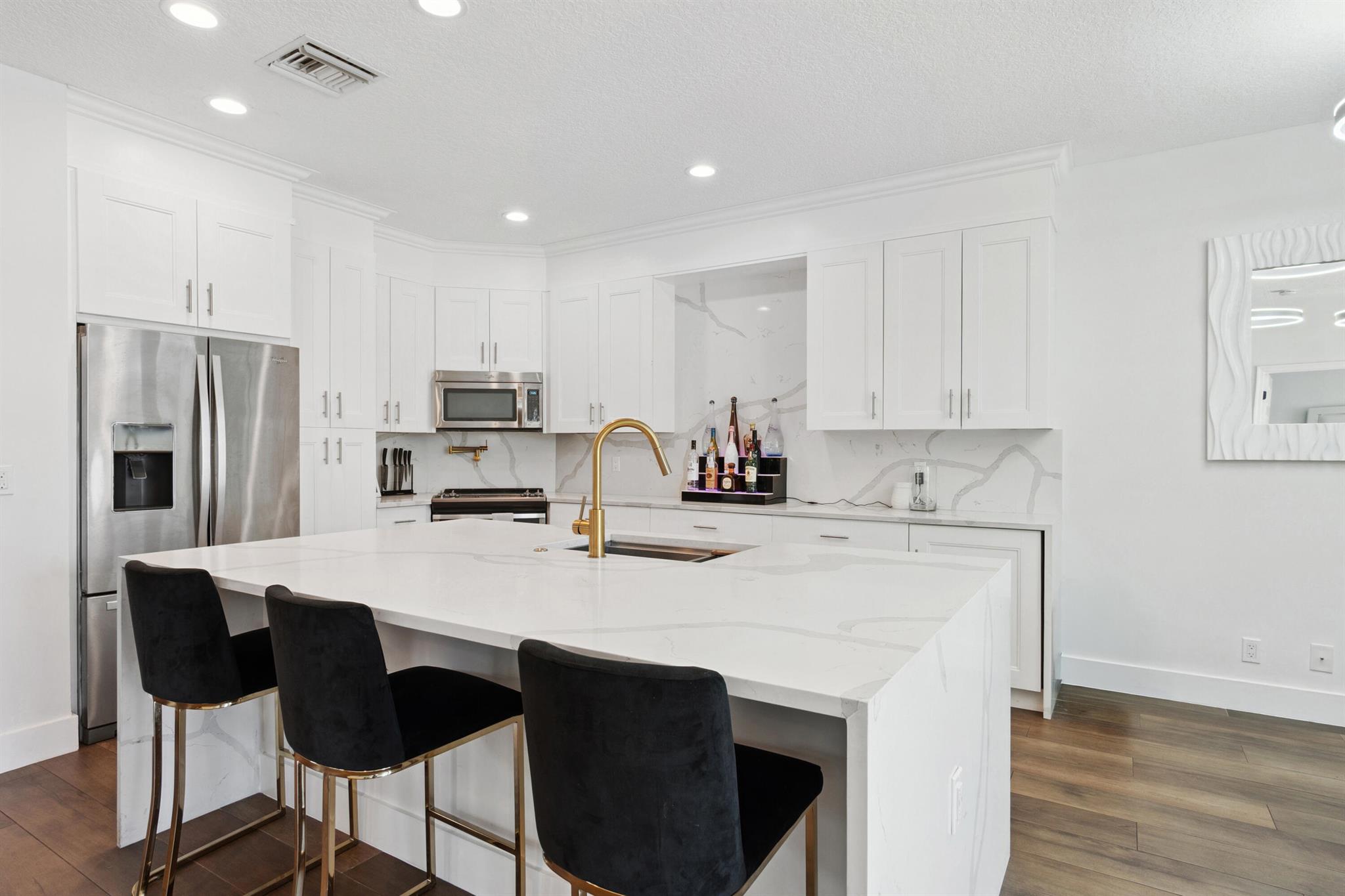 Step into this stunningly renovated 3-bedroom, 2-bathroom home nestled in the prestigious gated community of Boca Preserve, a rare find in the heart of East Boca. This light-filled residence boasts high ceilings, floor-to-ceiling sliders, and a seamlessly updated transitional design​​‌​​​​‌​‌​​​‌‌​​​‌‌‌​​‌​​‌‌​​​​ throughout.