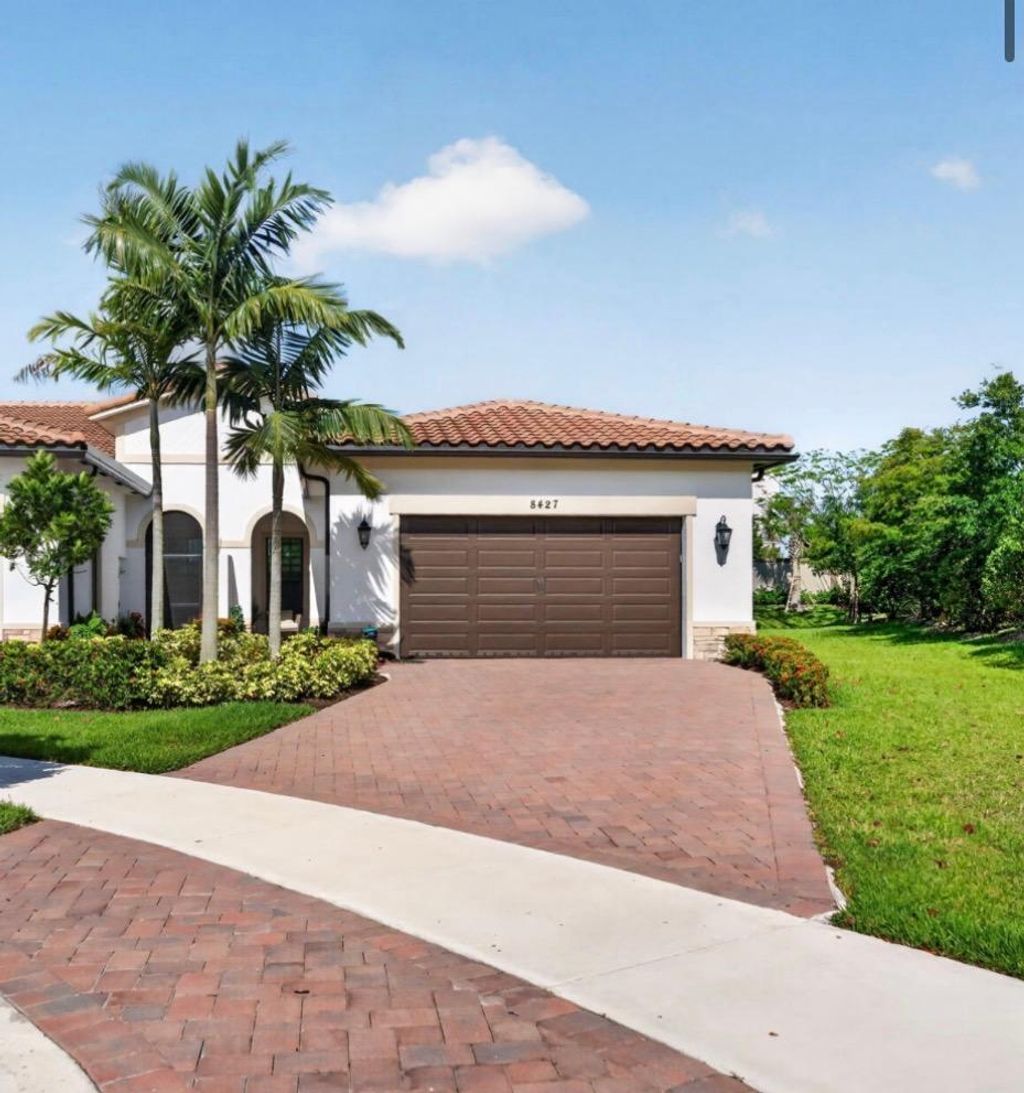 Photo of 8427 W Blue Spring Drive, Parkland, FL 33067 (MLS # B26022770)