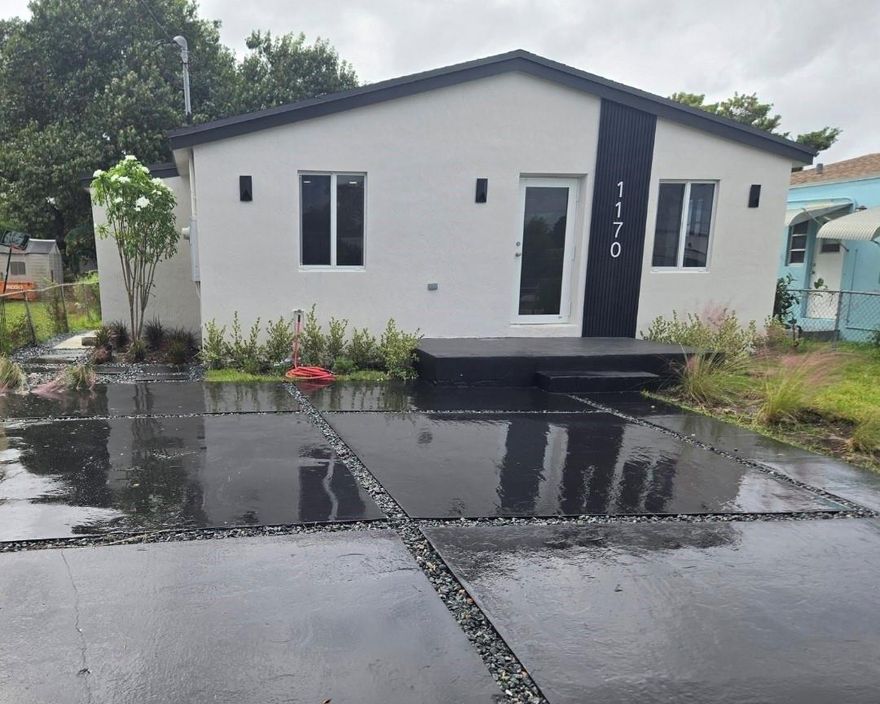 Discover this beautifully remodeled home in the heart of Miami-Dade County. Ideally located just 10 minutes from the airport, beaches, Downtown Miami, and Wynwood, this property offers both convenience and modern comfort. This stunning home features a brand-new roof, new A/C unit, new electrical panel, tankless water heater, custom closets, and frosted glass vanities. It has been fully insulated and includes impact windows and doors, providing significant savings on homeowners insurance and FPL bills. Enjoy an open-concept layout with new flooring throughout, new bathrooms, and a new kitchen complete with an island and stainless steel appliances. The property also boasts a spacious backyard, perfect for entertaining guests or providing plenty of room for kids to play.