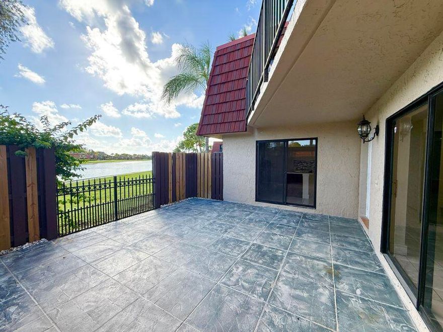 Rarely available corner-unit townhouse in Boca Raton offering 3 bedrooms, 2.5 bathrooms, and 1,589 sqft of living space. This spacious and nicely updated home features a bright open layout, modern finishes, stainless steel appliances, and plenty of natural light throughout. Enjoy a large private patio overlooking the tranquil lake along with a nice balcony, creating great indoor-outdoor living space perfect for relaxing or entertaining. Brand-new A/C installed June 2025. Currently tenant-occupied and rented at $2,900/month. Roof replacement special assessment is $150/month with approx. 85 payments remaining. HOA does not allow rentals during the first year of ownership. Recently appraised at $404,000 and priced below market value. Previous buyer's mortgage fell through—great opportunity.
