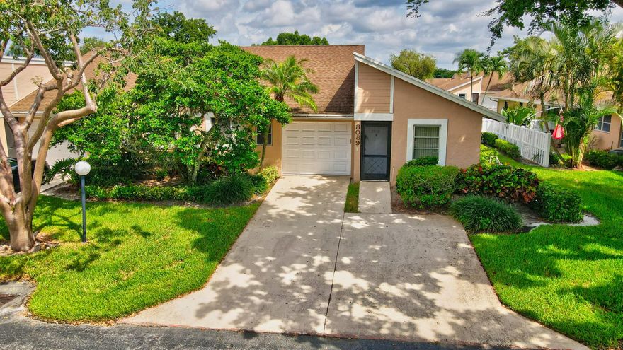 Welcome to this beautifully updated villa with a brand-new roof, tucked away in the peaceful, gated community of Whisper Walk in Boca Raton. Thoughtfully renovated, this inviting home features soaring volume ceilings, a spacious one-car garage, and stylish vinyl flooring throughout. The contemporary island kitchen is a true centerpiece, boasting quartz countertops, stainless steel appliances, and modern lighting that enhances its sleek design. Enjoy the added living space of a Florida room, a private patio perfect for relaxing or entertaining, and two generously sized bedrooms, each offering ample closet space. The home is complete with two well-designed bathrooms, combining comfort and practicality.Whisper Walk residents enjoy access to a wide range of resort-style amenities.