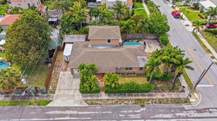 Unlock the full potential of this mid-century modern diamond in the rough in centrally located "College Park." Whether you're an investor seeking immediate upside or an end user looking to create a custom dream home, this property offers flexibility, value + options. One route is light renovation while maintaining the current layout to quickly build equity and generate **dual income streams** with the separate cottage or Option B - Fully execute the already **approved plans** to transform the property into a stunning  3,500+ sq ft luxury home (Check the comps - the ARV is already exists based on nearby renovated comps) The existing layout is 4 BR, 3.5-bath main residence w/ an expansive upstairs owner's suite w/ en suite (and impact windows.) and 3 bedrooms on main level. (continued) Key updates—such as a 2017 roof, updated kitchen, and 2011 addition—provide a strong foundation for further improvements.  A separate-entry 1-bedroom, 1-bath apartment offers excellent income potential, guest accommodations, or flexible living space, with room to add a kitchenette and lounge area.  The fully fenced property creates a private outdoor retreat, complete with a pool, expansive party deck, and prime space for a future tiki hut or other style of outdoor entertaining area.  Additional features include dual A/C systems, updated electrical panels (main house), gas appliances and natural gas plumbing, refinished original oak floors, and a mix of hurricane panels and impact glass.  Located just minutes from the best of the area—bike to local restaurants, shops, and the popular Beach Club Tiki Bar, or enjoy a short drive to downtown and the beach.  Endless possibilities. Immediate upside. Prime location.