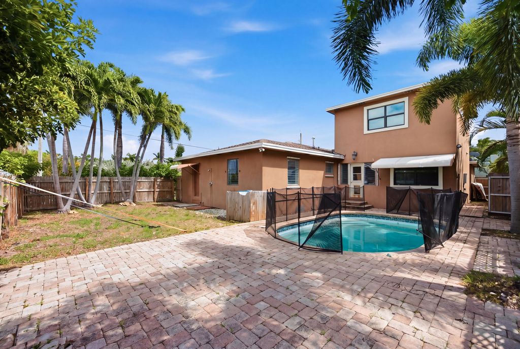 Photo of 303 Cornell Drive, Lake Worth Beach, FL 33460 (MLS # B26019621)