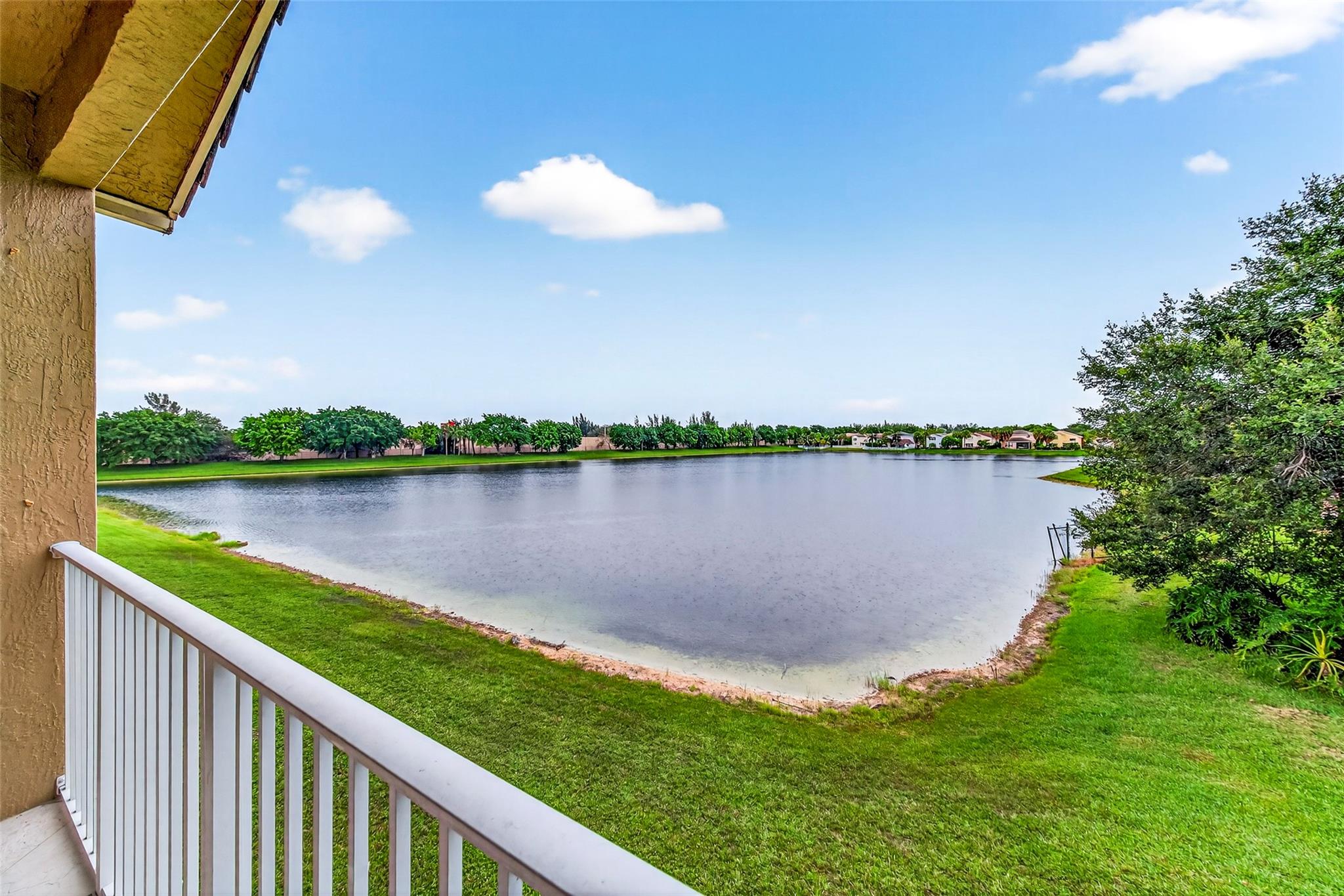 Beautiful lake view from this second floor condo. Open kitchen, 3 bedrooms plus den with flexible options as a TV room, office or even additional bedroom. Extra attic storage too! Enjoy all the amenites of guard gated Silver Falls, community pool, tennis courts and playground very close to your new home. Fitness center & clubhouse also available for resident use. Cable TV & Wifi included. Parking includes your own garage and driveway as well as plentiful open resident parking.