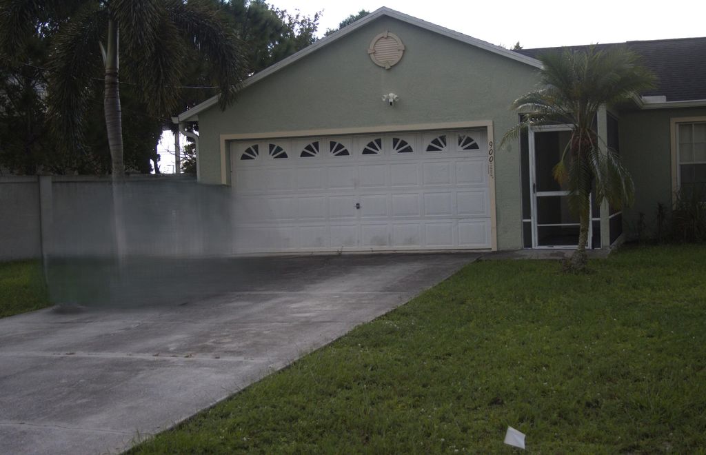 Photo of 900 SW Dubois Avenue, Port Saint Lucie, FL 34953 (MLS # R11125884)