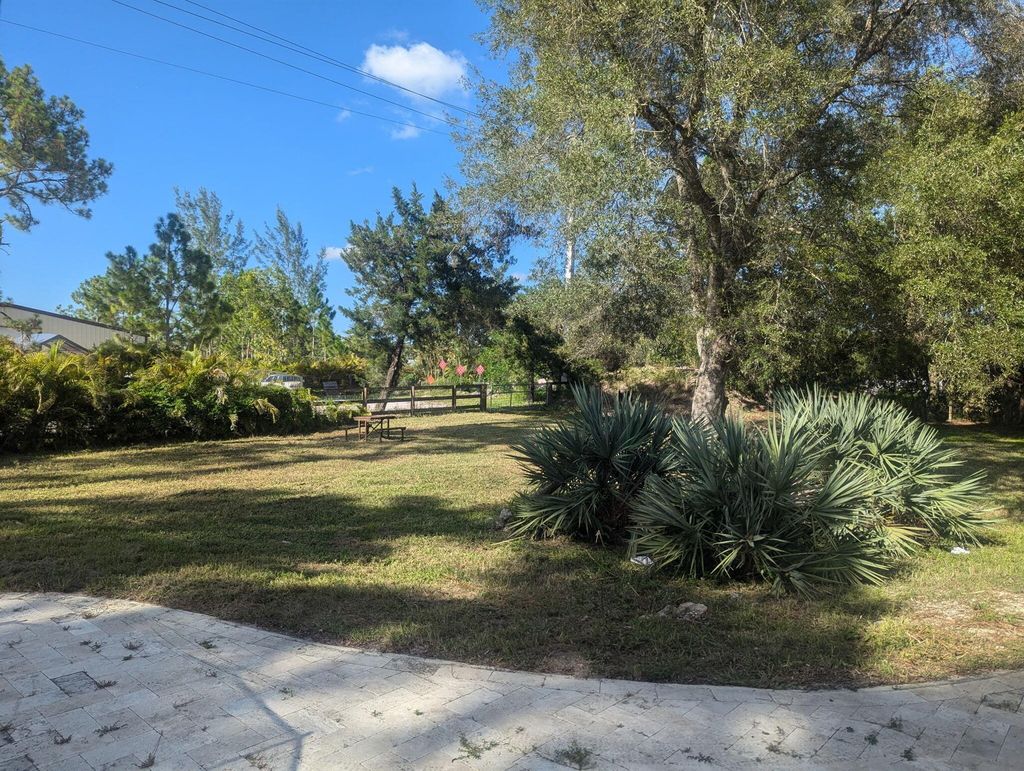 Photo of 17025 Temple Boulevard, The Acreage, FL 33470 (MLS # R11109542)