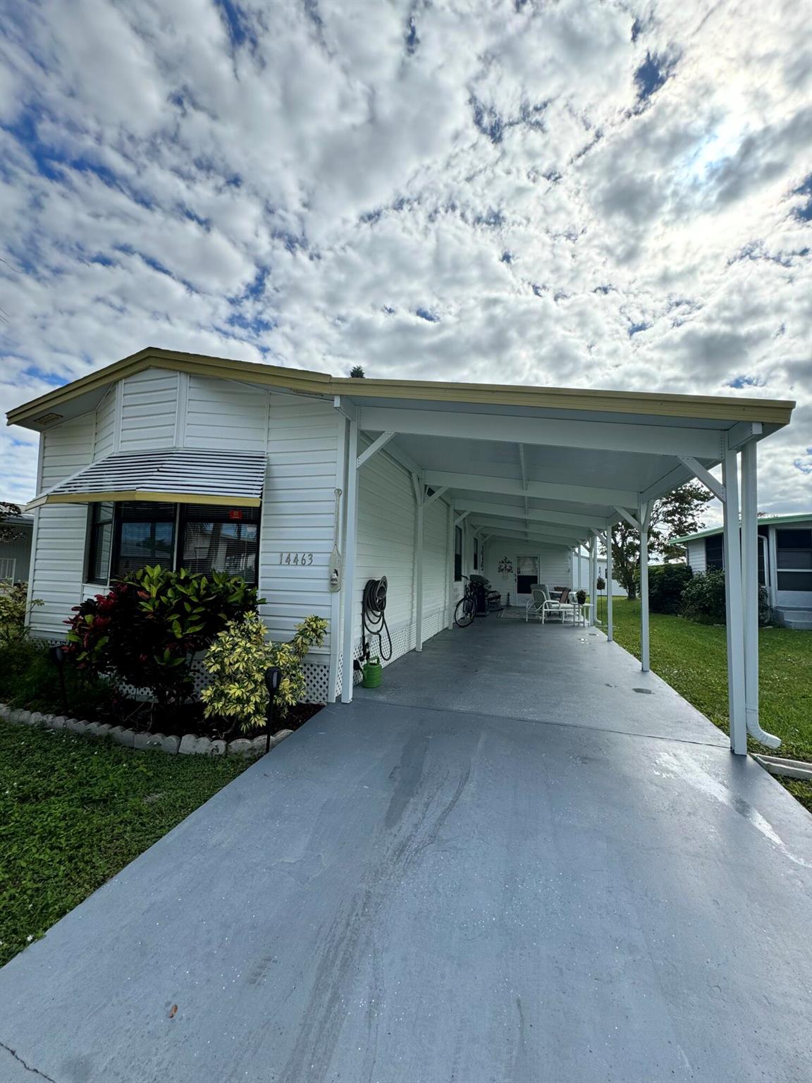 Immaculate 2 bedroom 2 bath home located in the desirable 55 + Spanish Lakes Fairways community. Split floor plan. Home has laminate floors throughout. NO CARPET. Open kitchen, screened in patio with windows off living room. Bathrooms have new vanities and toilets. Large carport space and large 8 X11 shed. Home is being sold FURNISHED. A/C 2015, Water heater is 2022. Washer machine is 2017. Appliances are in great shape. Amenities include Private 18 hole golf course, 2 pools, pickle ball, tennis, shuffleboard, bocce, gym, library, wood workshop and much more. Low Lot Rent. MUST SEE!