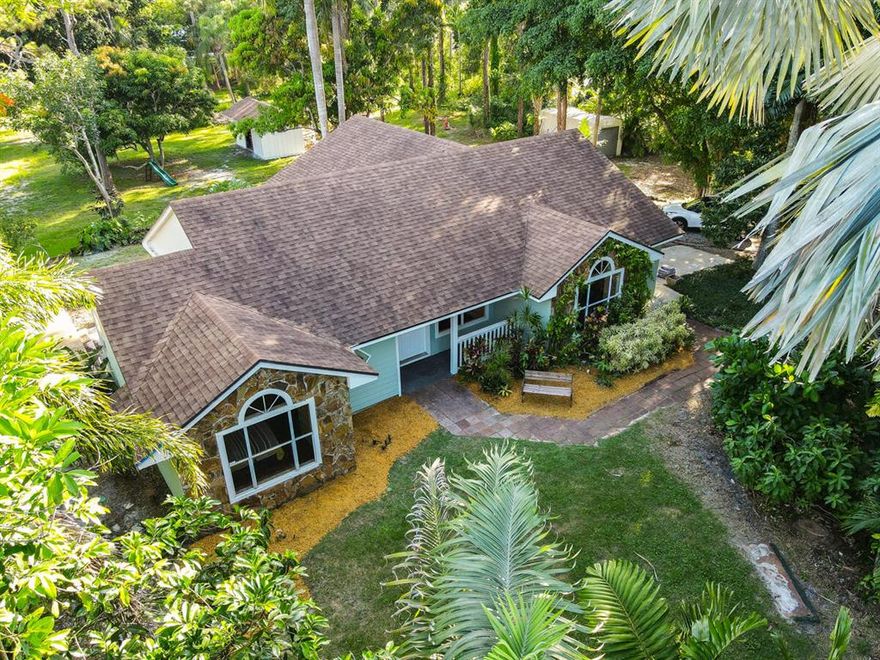 2.4 AMAZING ACRES AND BEAUITFUL  REMOLDED HOME, HOME IS A TRUE SPLIT PLAN, W/ OPEN LIVING ROOM & FAMILY ROOM AND KITCHEN, TILE THROUGHOUT, NEWER ROOF (2017).
EXTRA SHED WITH NEW ROOF (2021) AND MUCH MORE.
ALL THIS AND JUST A SHORT WALK TO  OR BIKE RIDE TO EITHER CYPRESS CREEK NATURAL AREA OR HUNGRYLAND WILDLIFE AREA, WITH RIVERBEND PARK JUST DOWN THE ROAD.
 IF YOU ENJOY HIKING , BIKING OR JUST WATCHING NATURE THIS HOME IS FOR YOU. LOT IS VERY SECLUDED AND FULLY FENCED WITH MATURE LANDSCAPING THROUGHOUT - ROYAL PALMS, FOX TAIL PALMS & CANARY DATE PALMS AND MORE!