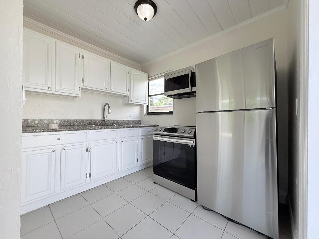 Photo of 1409 W 33rd Street #1, Riviera Beach, FL 33404 (MLS # R11137991)