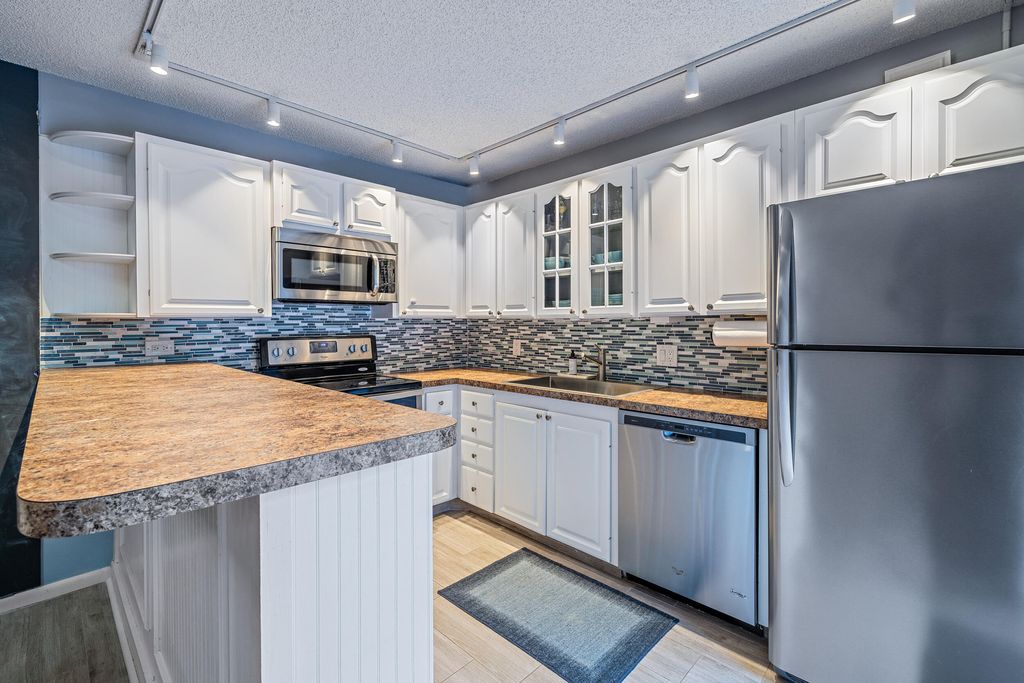 Photo of 1311 13th Terrace, Palm Beach Gardens, FL 33418 (MLS # R10798945)