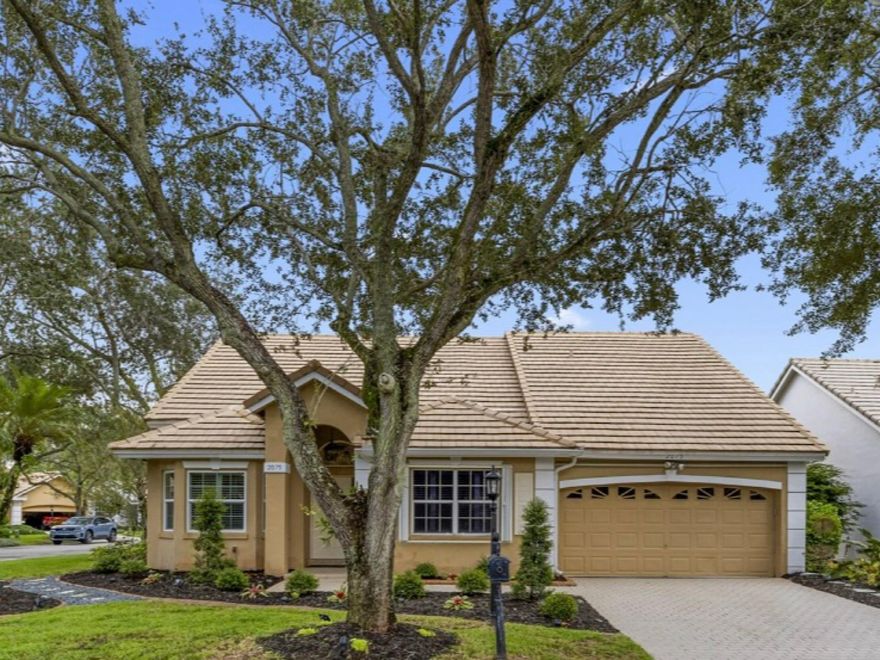 Located in the very exclusive gated Eagle Trace Country Club. Beautifully Updated Home on a Corner Cul-de-Sac Lot within the Georgetown community. This residence offers 3 bedrooms plus a versatile bonus room perfect as a den, office, or 4th bedroom. The open concept kitchen with soaring vaulted ceilings highlights an impressive 11-foot quartz peninsula with matching backsplash, lighted upper and lower cabinets, a wine fridge, and Brand New KitchenAid appliances. French doors open to the screened patio, ideal for entertaining or everyday relaxation. Smart dimmer switches and high-tech lighting add modern convenience throughout. Luxury vinyl plank flooring flows seamlessly, complemented by exotic fixtures and fresh interior paint completing a stylish, truly move-in ready home.