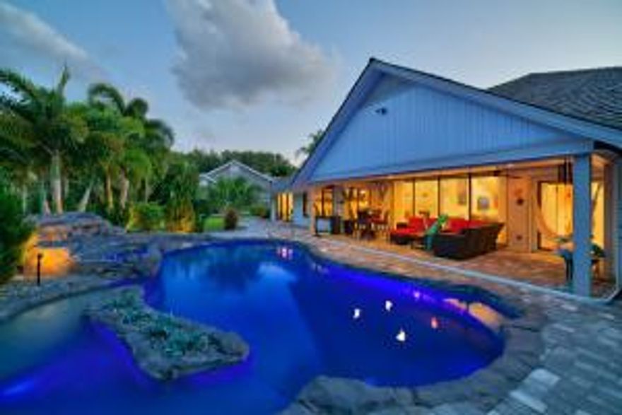 Over 300k in upgrades in this one of a kind property!  This elegant lakefront home has been completely upgraded. This home has gorgeous marble in the living room and the and bedrooms have authentic wood flooring. Crown molding through out the home and vaulted ceilings with fresh paint give a modern look and luxurious feel. Custom built closets in all bedrooms! New impact windows and doors. Mazza Interior wall upgrades throughout! Two new air conditioning units inside along with a new exterior fence outside.  LED lighting upgrades inside and outside! The landscaping has also just been redone and provides a perfect peaceful setting for the beautiful heated pool with spa and waterfall!! UPGRADE LIST INCLUDES:
TWO NEW AC UNITS,SWAROVSKI CHANDELIERS, MARBLE FLOORS, $8500 THERMADOR REFRIGERATOR, MAZZA INTERIOR WALL UPGRADES, HEATED POOL, CROWN MOLDING, DUAL OVENS, DUAL DISHWASHERS, RECENTLY LANDSCAPED, NEW FENCE, ABLE CLOSET SYSTEM, FRONT LOAD W/D. UPGRADED CEILING FANS, IMPACT WINDOWS AND DOORS, INTERIOR DESIGNED WINDOW TREATMENTS, SHADES WITH ALUMINUM SUN BLOCKERS, CUSTOM QUEEN SIZE MURPHY BED, AUTOMATIC HAND DRYER