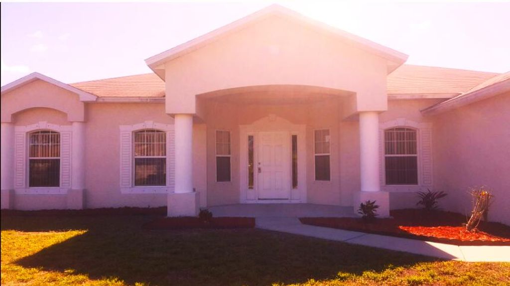 Photo of 1026 SW Barbarosa Avenue, Port Saint Lucie, FL 34953 (MLS # R10866094)