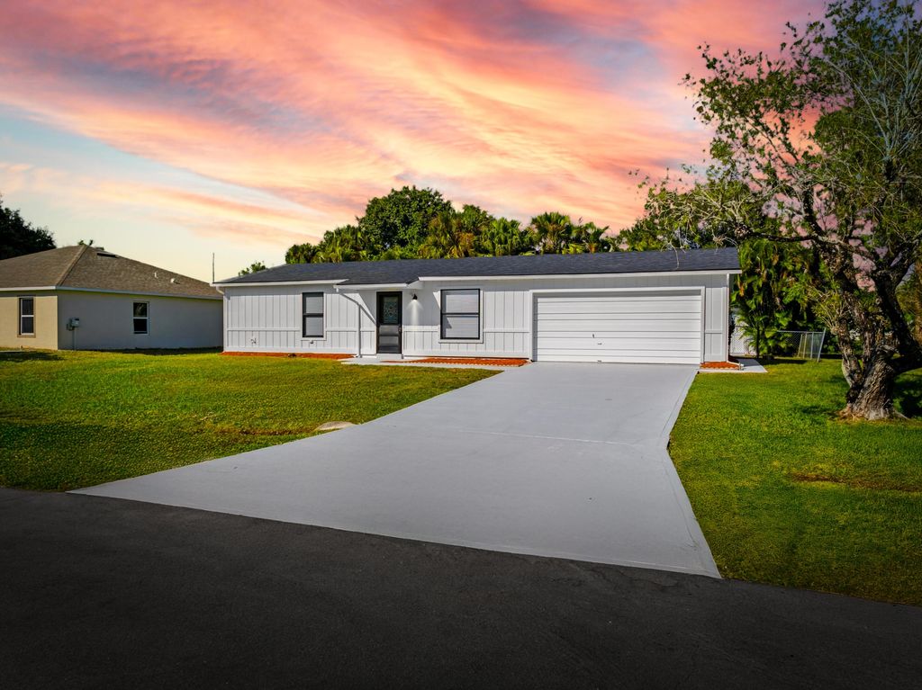 Photo of 1001 SW Romaine Lane, Port Saint Lucie, FL 34953 (MLS # R11141451)