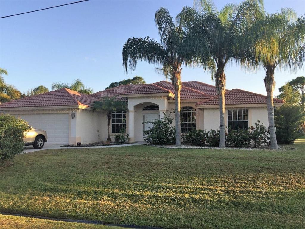 Photo of 1218 SW Emerald Avenue, Port Saint Lucie, FL 34953 (MLS # R10715352)