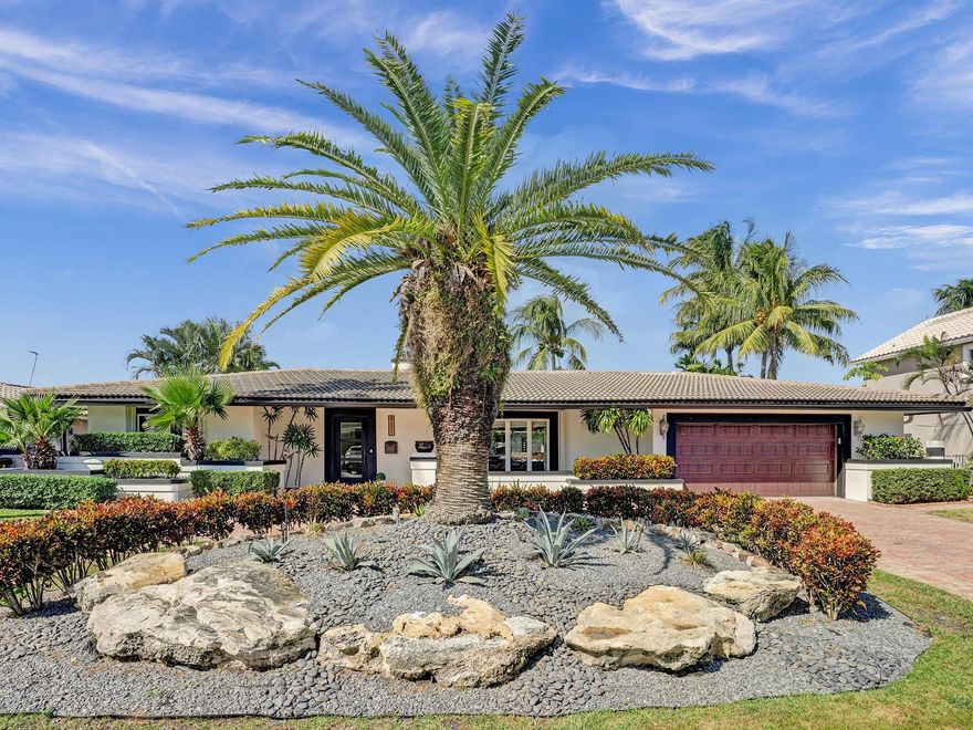 This gorgeous remodeled open concept light and bright Venetian Isles home in Lighthouse Point  is sure to please.  Beautiful landscaping outlines timeless Chicago brick in the front and back yards.  Enter into a large open living room with fireplace and crema marfil marble. The pocketing sliding doors brings the outside in.  3 bedrooms with 2.5 baths.* Split bedrooms* High end chefs kitchen* Large cabana bath in the guest wing with double sinks, jacuzzi tub and separate shower.  Step outside into an oasis that includes a heated pool, built in barbeque, bar area, multiple seating areas,fire pit  and 90 feet of dockage with no fixed bridges close to the inlet.