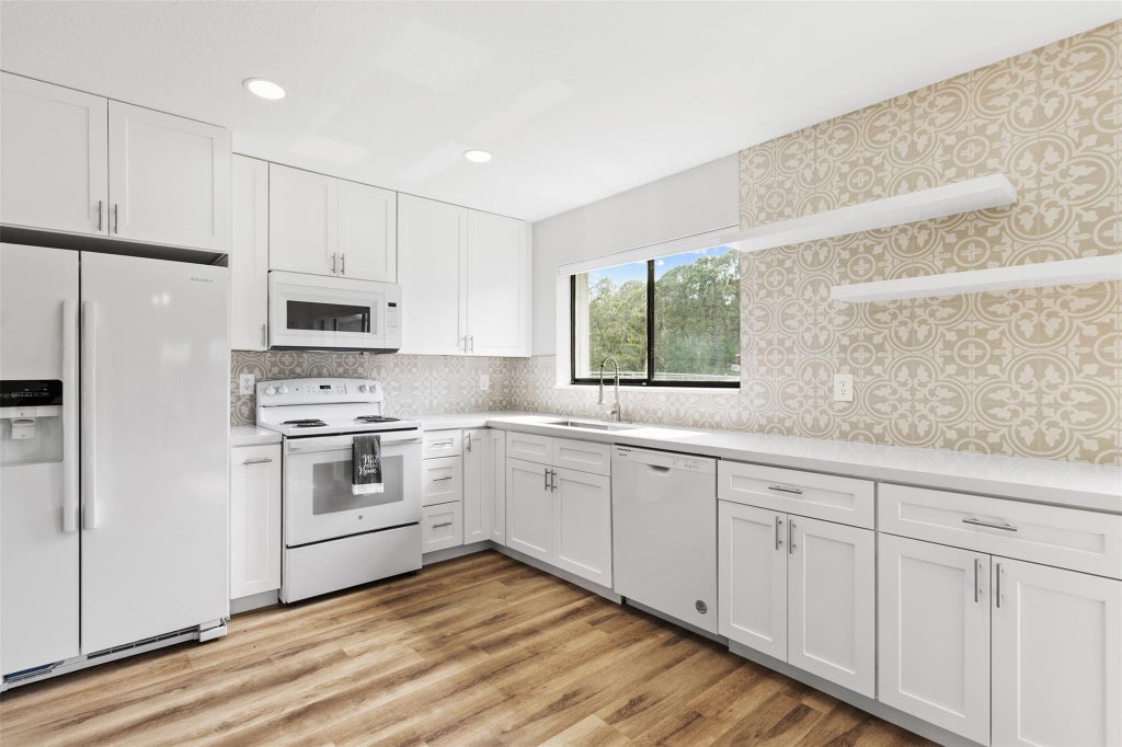 Photo of 1902 SE Burgundy Lane, Port Saint Lucie, FL 34952 (MLS # F10506774)