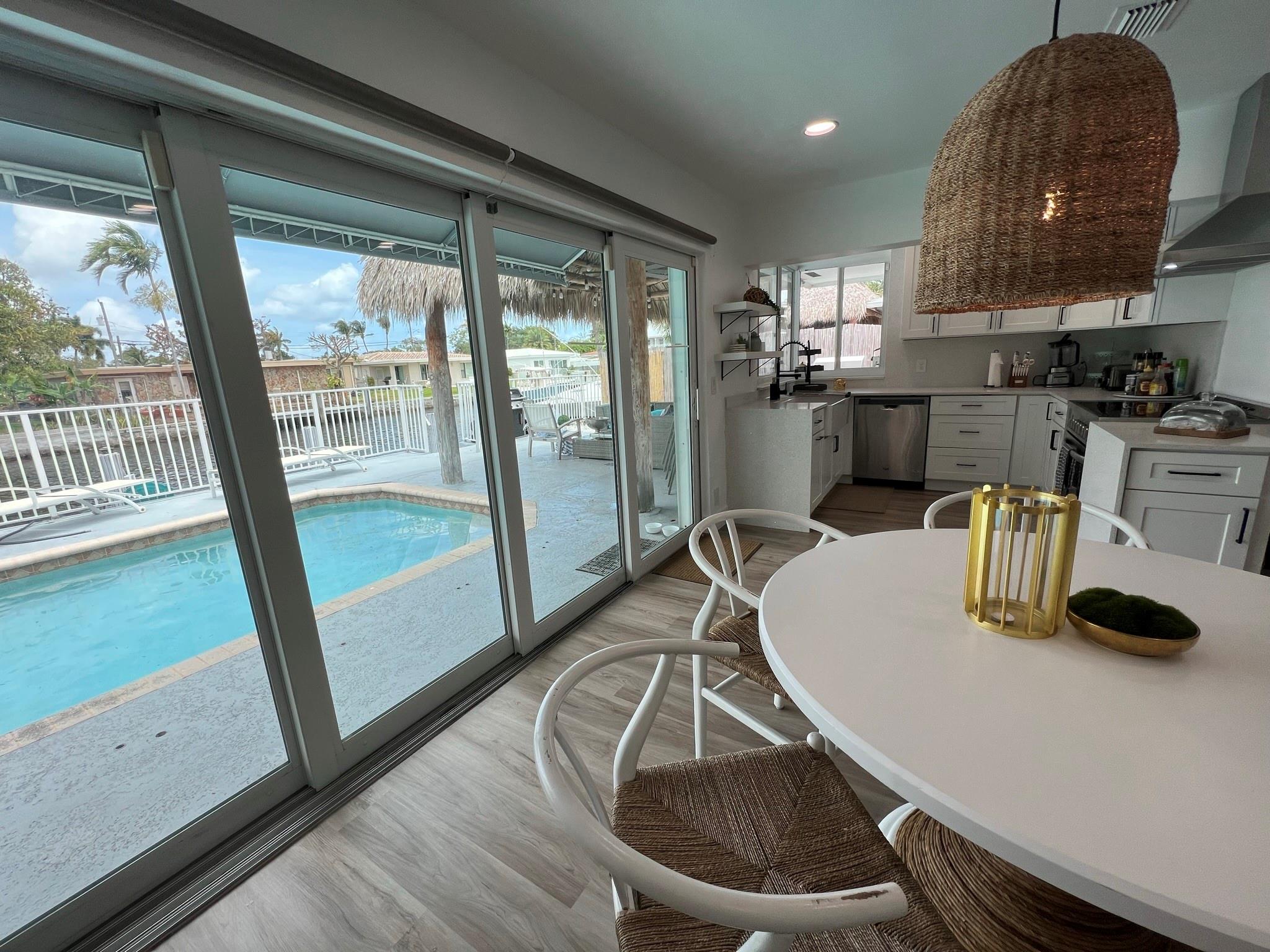 Deep waterfront home with heated pool, hottub and outdoor kitchen. Furnished 3 bedroom/3 bath plus bonus room with sleeper sofa.