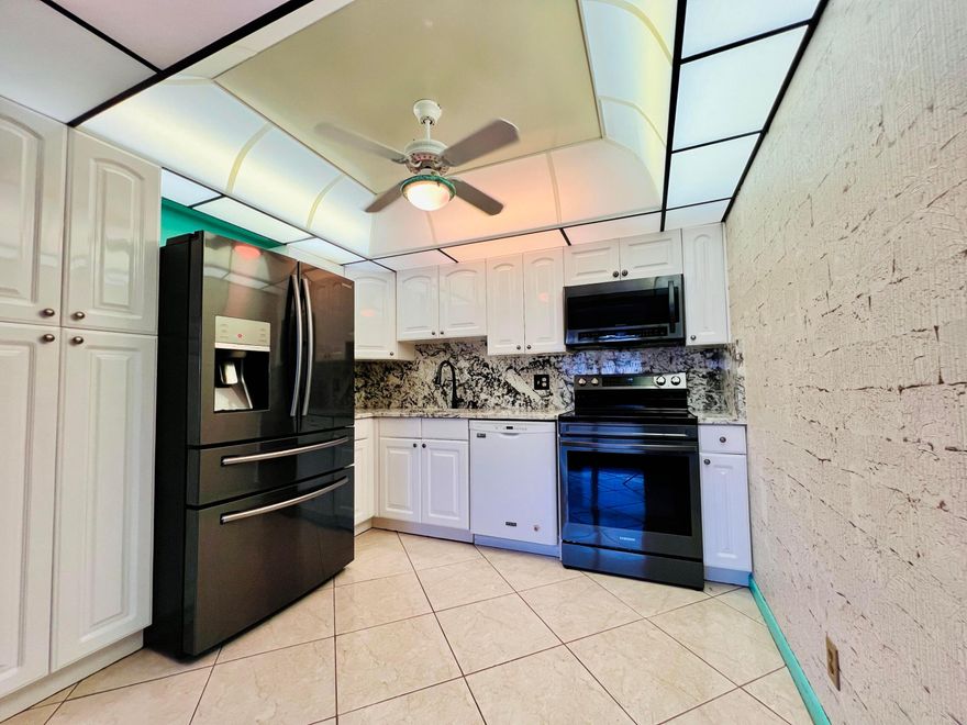 SPACIOUS WITH PRETTY WATER VIEWS IN 55+ CENTURY VILLAGE! Desirable Ground Floor 2/2 in the Luxury Wellington Section. Pretty Updated Kitchen W/ White Cabinets, Upgraded Granite Counters, Upgraded Appliances (French Door Refrigerator, Smooth Top Range, Built-in Microwave, and Dishwasher). Nicely Updated Guest Full Bath W/ Step-in Shower. Spacious Water View Bedroom Suite. Neutral Tile Flooring. Enjoy Pretty Views From the Enclosed Lanai. Quiet Location Within the Building! Park Within Steps of Your Front Door. Luxury Building W/ Extra Storage, Trash Chutes, and Access to the Two Private Pools for Wellington Section Residents! Fantastic Location Close to the Main Clubhouse & Haverhill Gate. Century Village Is A Vibrant 55+ Community Centrally Located in Desirable Palm Beach County! Enjoy... Century Village is a 55+ Resort Style community with so much to offer - Much To Offer - shows, movies, clubs, pools, security, and transportation service. The Clubhouse features a theater, indoor pool, card room, community/party room, billiard room, shuffleboard, tennis, pickleball, bocce, and two outdoor pools, Numerous heated outdoor pools throughout the community. Separate fitness center with gym and outdoor heated pool & resistance pool. Two guarded gates and 24-hour roving security patrol.