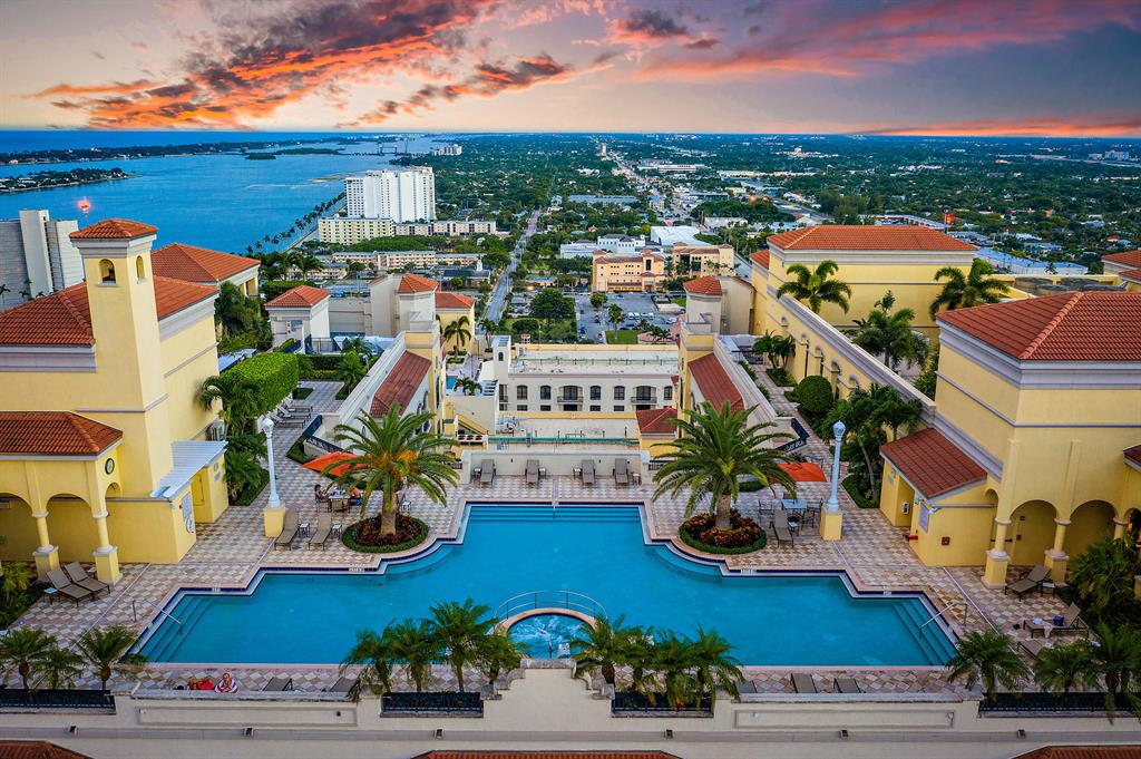 PRICED TO SELL! There is nothing like 2 City Plaza - BEST VIBE, BEST VIEW! Enjoy Rooftop Pool 360 views of Palm Beaches! GORGEOUS RARE 17th Fl unit offering spectacular INTRACOASTAL VIEWS @ this price! Enjoy breakfast on your balcony! Wireless custom shades open to welcome rays of sunshine streaming thru expansive FLOOR TO CEILING WINDOWS! Southern exposure light & OPEN FLOOR PLAN. Designer lighting / fixtures + updated Kitchen add special touches that today's buyers are looking for. 2nd bedroom offers custom built-ins w/ shelves, bed, cabinetry & lighting plus ADDITIONAL STORAGE for guests. BONUS light-filled DEN provides extra OFFICE SPACE. Valet or park, bike to the beach / downtown West Palm just minutes away: Dining, shopping & cultural events at the Kravis Center! PET FRIENDL