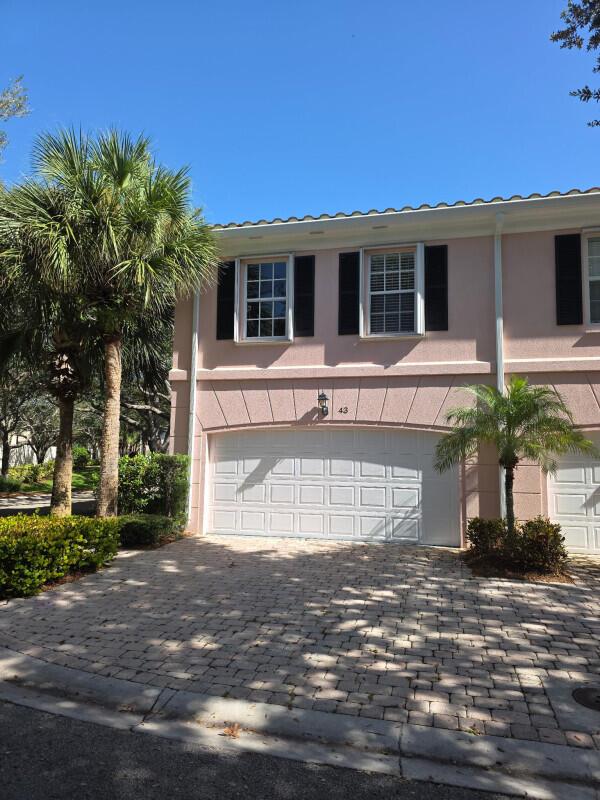 WOW LOCATION LOCATION LOCATION! Beautiful hidden gem in the very desirable community of Tequesta Oaks is move-in ready CORNER UNIT! Beaches, shopping and numerous restaurants are within walking distance. This Tequesta Oaks townhome has 3 Bedrooms (walk-in closets with modular organizers), 2.5 Baths with a beautiful upgraded 2-Car Garage with lots of storage plus parking on driveway. Beautifully appointed with marble floors and marble baths, marble countertops, stainless steel appliances, open stairwell, many beautiful upgrades and finishing touches throughout. Townhome has a central vacuum, 9' ceilings, accordion hurricane shutters and storage room. Washer and Dryer located upstairs with storage cabinets above. A/C recently replaced.