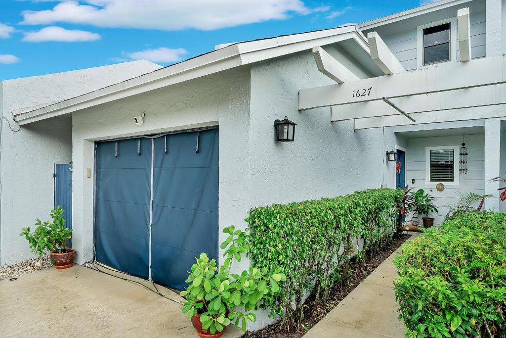 Photo of 1627 Woodbridge Lakes Circle, West Palm Beach, FL 33406 (MLS # R11120304)