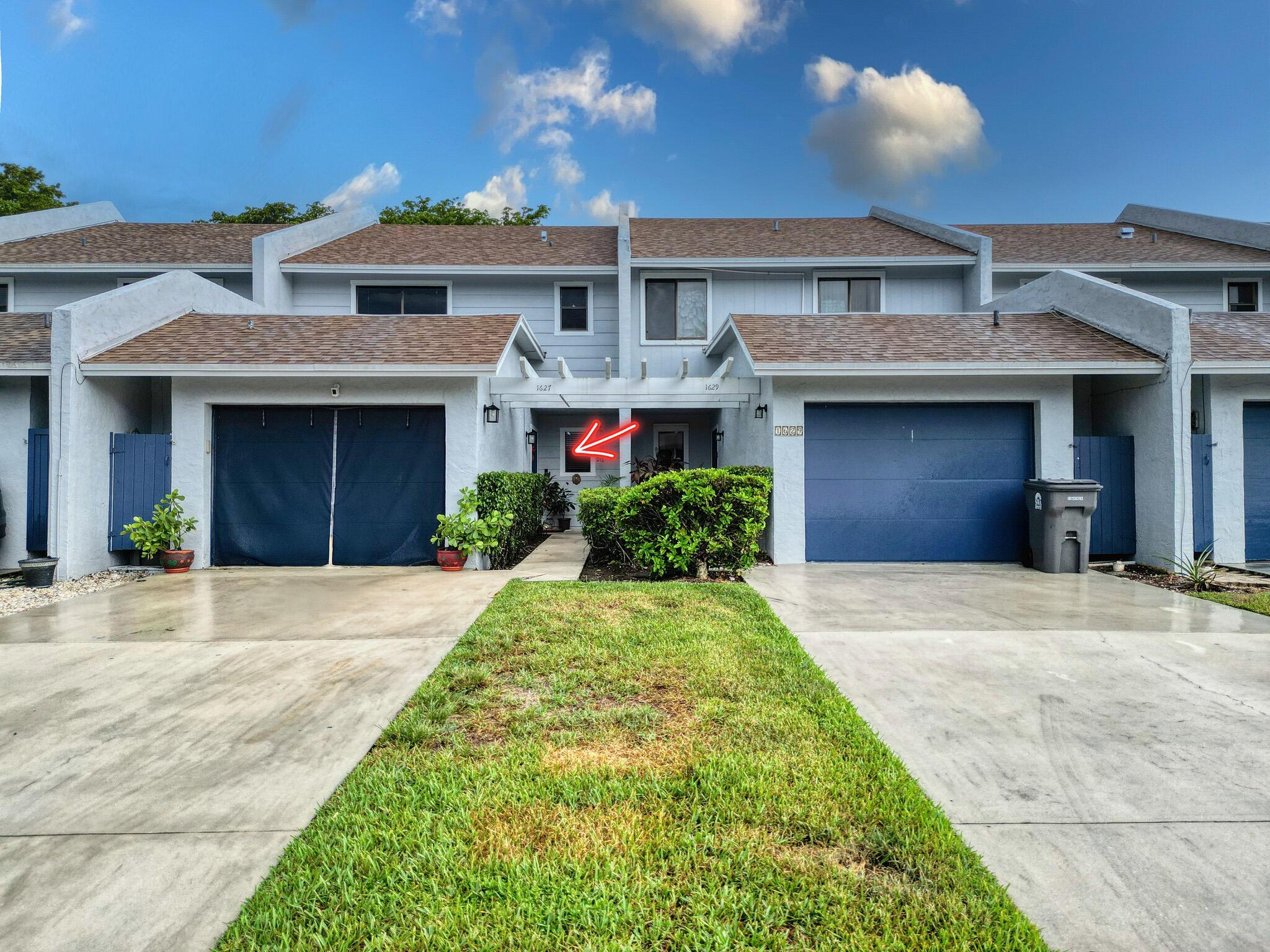 Welcome to this spacious 3-bedroom, 2.5-bathroom townhouse with 3rd room used as a den/office, perfectly situated in the desirable Woodbridge Lakes community of West Palm Beach. This well-designed home features an inviting open floor plan with abundant natural light, a den that can serve as an office or guest space, and a serene lakefront view that provides a tranquil backdrop for everyday living. Tile floors were installed throughout 2022. The primary suite offers generous closet space and an en-suite bathroom for added privacy, while the second bedroom is well-sized for family, guests, or flex space. The screened-in patio overlooking the lake is ideal for relaxing, entertaining, or simply enjoying the peaceful Florida lifestyle. Woodbridge Lakes is a pet-friendly community featuring