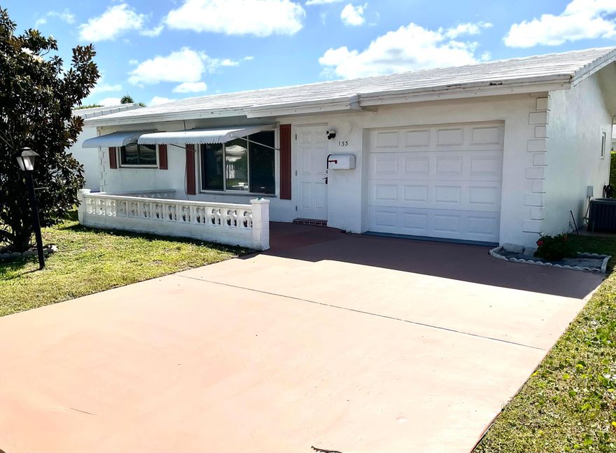 Cozy single-family home on a quiet street close to shopping, transportation, restaurants and major thoroughfares.This home features 2 beds/ 2 baths,  impact windows and doors, "instahot" tankless water heater, Venetian plaster finishes,  AC is one year old, flat roof replaced 2026.  All located in an active and vibrant 55+ community with 3 clubhouses, fitness facility, 18 hole 3 par golf course free to owners.  This low HOA community offers many clubs, bocce ball, cornhole, and men's and ladies golf leagues.