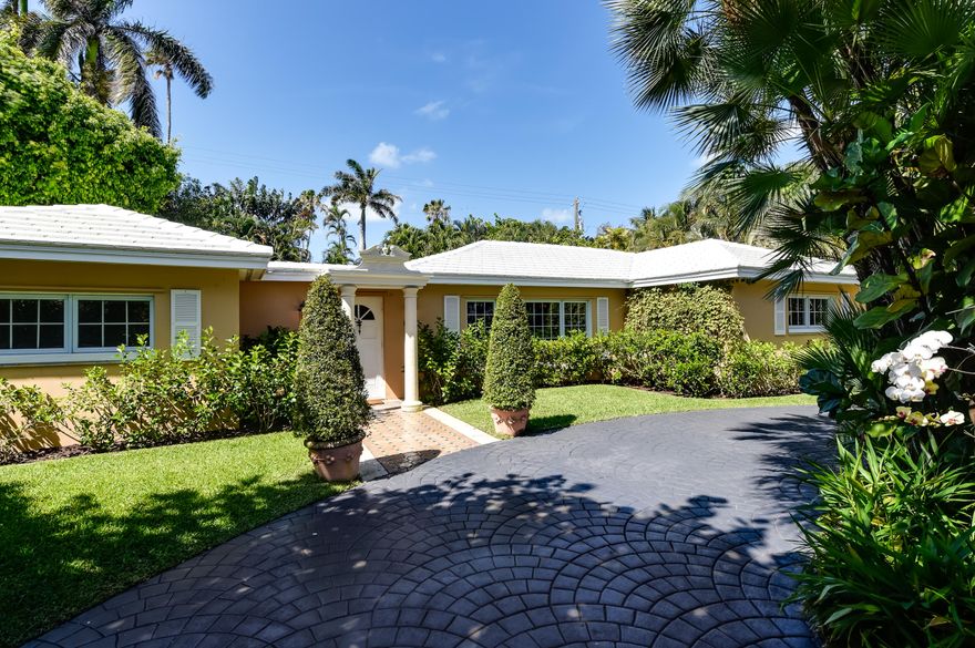 Renovate or build new on this 100'x 115' lot. Palm Beach pool home offering 3 bedrooms, 3 baths plus a one bedroom guest house with bath and kitchenette. The loggia, master and pool house all open onto the lush gardens and large pool. Close proximity to the beach and the lake trail!