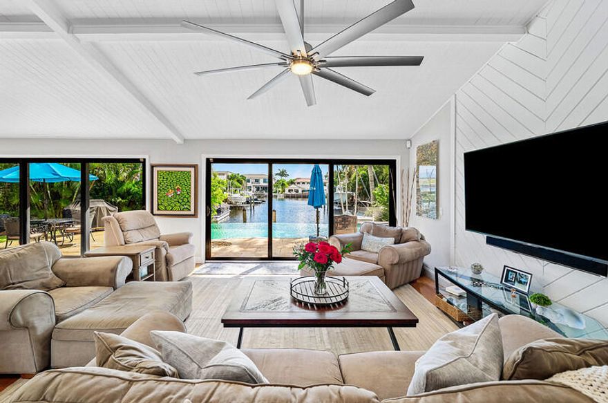 Amazing opportunity to live near the beach. 4 bedroom,2 bath home with a two car garage and private pool. Bring your boat  or jet skis. No fixed bridges with easy access to the intracoastal and ocean. Featuring metal roof, impact windows and doors, Great for entertaining Fenced yard, and pristine landscaping. Ideally located less than 2 miles from downtwn Boca Raton and  world class shopping, dining and entertainment.