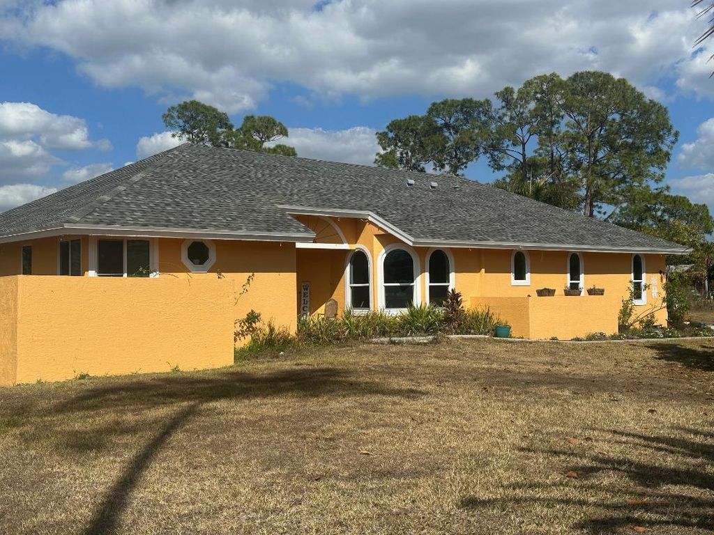 Photo of 15185 Tangelo Boulevard, West Palm Beach, FL 33412 (MLS # R11165821)