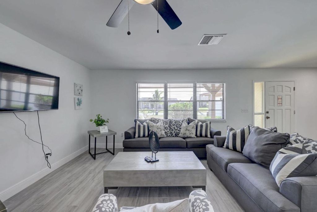 Photo of 543 SE Greenway Terrace, Port Saint Lucie, FL 34983 (MLS # R11156253)