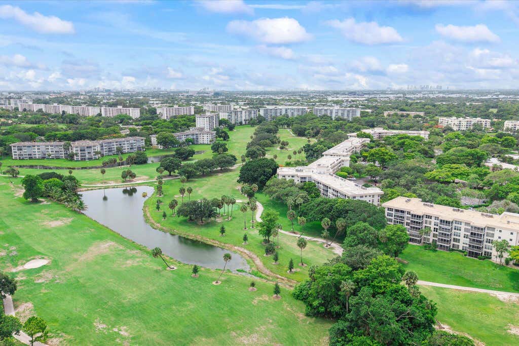 Photo of 3900 Oaks Clubhouse Drive #110, Pompano Beach, FL 33069 (MLS # B26038669)
