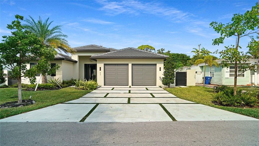 Modern Luxury in Wilton Manors. Stunning new construction home built to the latest codes on a spacious 9,373 sq. ft. lot near Wilton Drive. This 4-bed, 3-bath residence features an elegant open floor plan with 11-foot ceilings and European large-format tile throughout. The chef’s kitchen boasts high-end appliances and a massive island. The primary suite offers a spa-like bath with a standalone tub and separate shower. Outdoor features include a 12x20 heated pool, a covered patio, and a private CBS wall for maximum seclusion. The two-car garage is equipped with insulated doors and EV charging prep. Complete with a built-in BBQ area, high-impact protection, and elegant landscape lighting at night this home defines South Florida luxury living. ASK ABOUT THE HOMES LOW INSURANCE (under$4k)