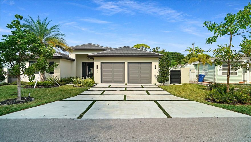 Modern Luxury in Wilton Manors. Stunning new construction home built to the latest codes on a spacious 9,373 sq. ft. lot near Wilton Drive. This 4-bed, 3-bath residence features an elegant open floor plan with 11-foot ceilings and European large-format tile throughout. The chef’s kitchen boasts high-end appliances and a massive island. The primary suite offers a spa-like bath with a standalone tub and separate shower. Outdoor features include a 12x20 heated pool, a covered patio, and a private CBS wall for maximum seclusion. The two-car garage is equipped with insulated doors and EV charging prep. Complete with a built-in BBQ area, high-impact protection, and elegant landscape lighting at night this home defines South Florida luxury living. ASK ABOUT THE HOMES LOW INSURANCE (under$4k)