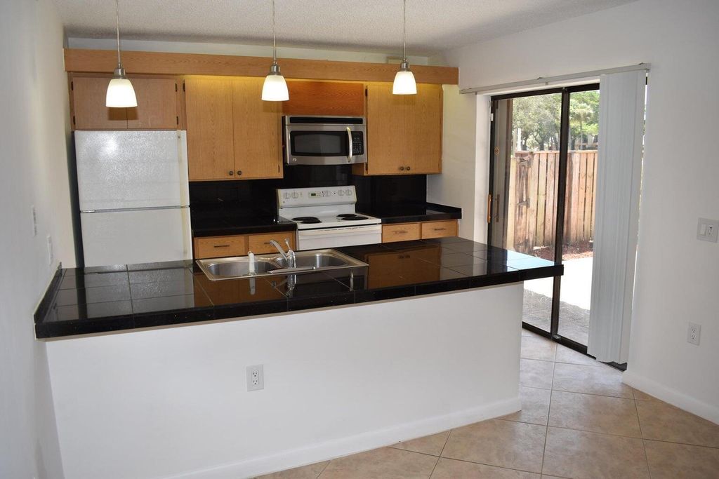 Photo of 5020 50th Way, West Palm Beach, FL 33409 (MLS # B26001393)