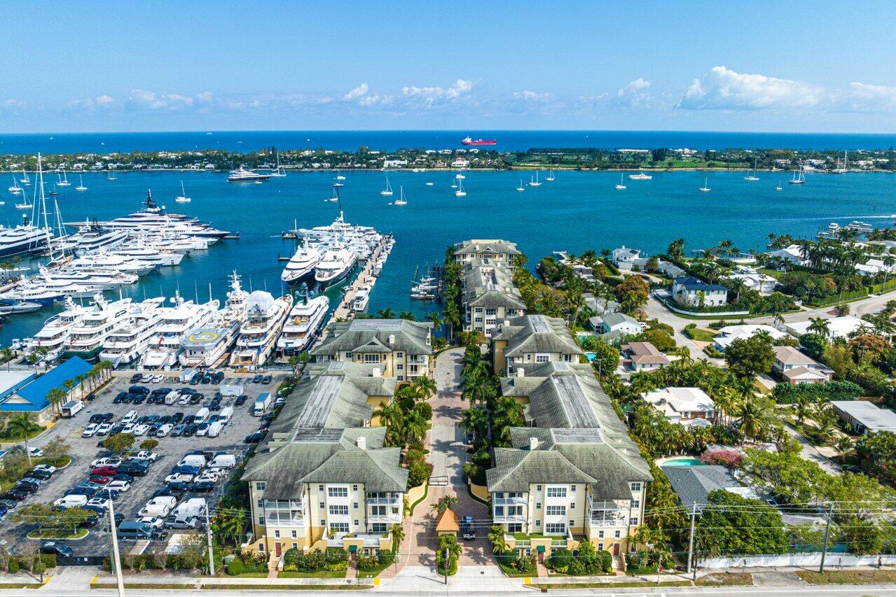 Welcome to your dream coastal retreata"an exquisite 2-bedroom, 2.5-bath penthouse residence community. Perfectly positioned just across the Intracoastal from Palm Beach Island and mere minutes from the vibrant heart of downtown West Palm Beach, this home blends luxury, privacy, and convenience.Step directly into your sanctuary via a private elevator from your 2 garage enclosed parking spaces. You are greeted by rich 9' wide-plank hardwood floors, elegant 7.5' crown molding, custom millwork, and raised 8' solid wood doors that elevate every room.