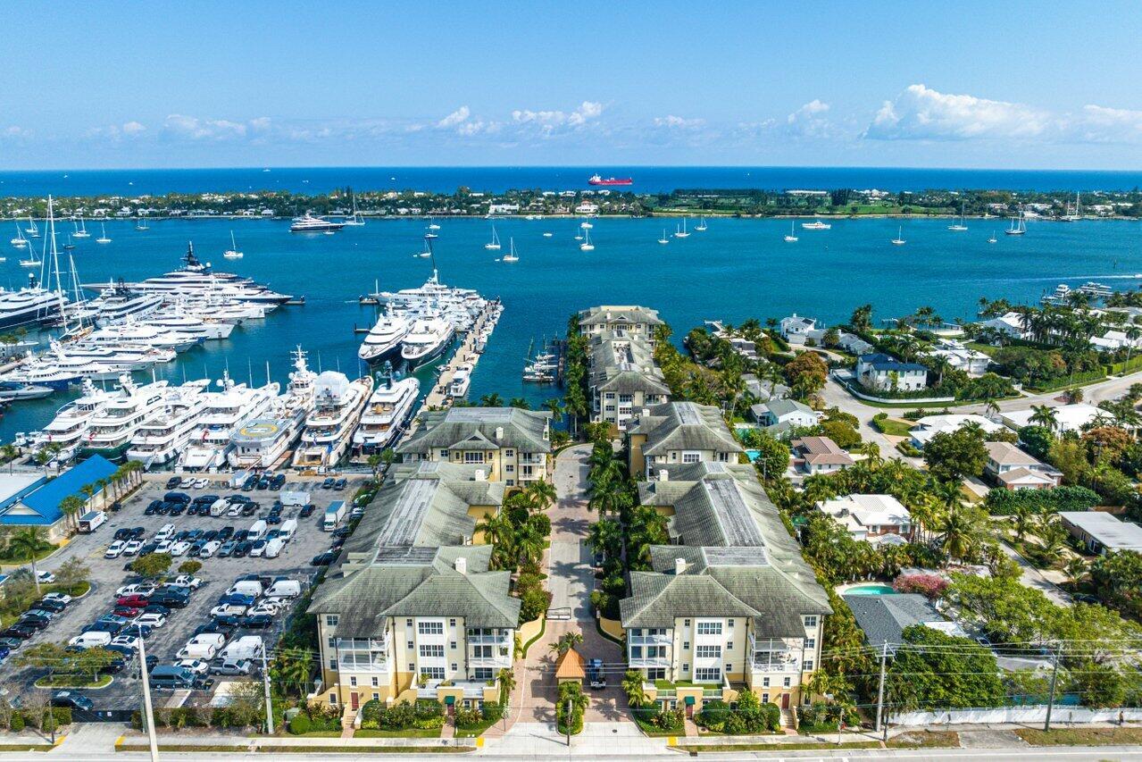 Welcome to your dream coastal retreata"an exquisite 2-bedroom, 2.5-bath penthouse residence community. Perfectly positioned just across the Intracoastal from Palm Beach Island and mere minutes from the vibrant heart of downtown West Palm Beach, this home blends luxury, privacy, and convenience.Step directly into your sanctuary via a private elevator from your 2 garage enclosed parking spaces. You are greeted by rich 9' wide-plank hardwood floors, elegant 7.5' crown molding, custom millwork, and raised 8' solid wood doors that elevate every room.