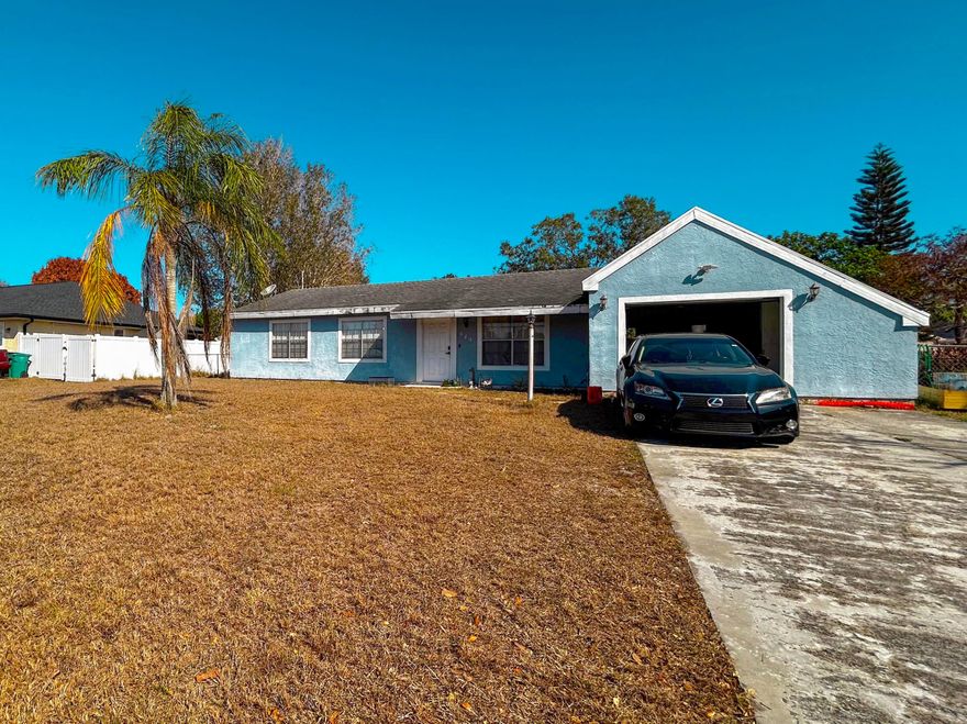 This single-story 3 bed, 2 bath home with an attached garage offers a great opportunity to update and make it your own. The property features a functional layout with a spacious living area and kitchen ready for your personal touches. Enjoy a  fenced backyard, open patio, and plenty of space with room for a future pool. Conveniently located just minutes from Gatlin Blvd and I-95, providing easy access to shopping, dining, parks, and everyday conveniences. No HOA. CASH ONLY. Property sold strictly AS-IS.