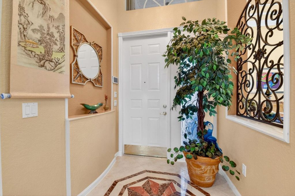 Photo of 7615 Tarpon Cove Circle, Lake Worth, FL 33467 (MLS # F10548788)