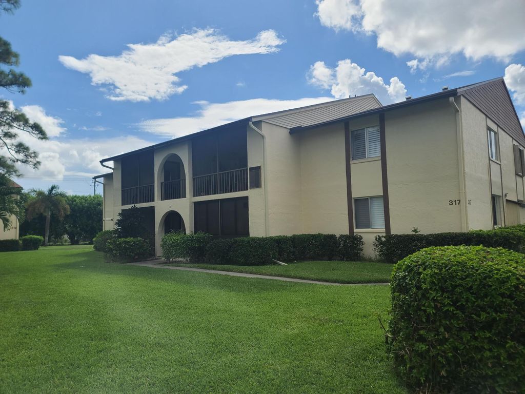 Photo of 317 Knotty Pine Circle #A-2, Greenacres, FL 33463 (MLS # R11122932)