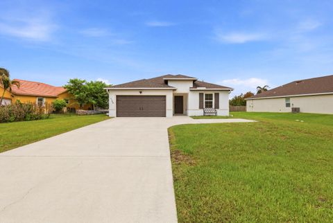 Photo of 1158 SW Del Rio BLVD, Port Saint Lucie, FL 34953 (MLS # B26037038)