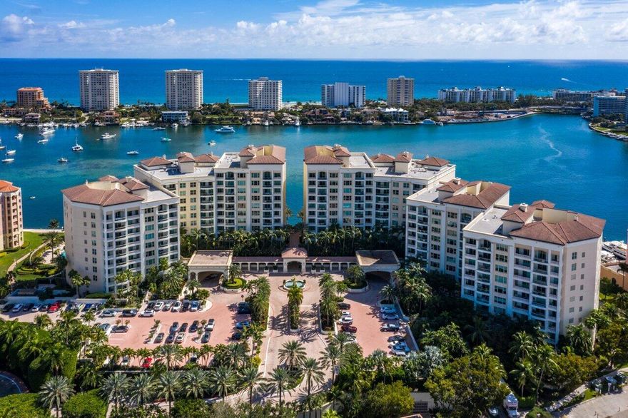 The crown jewel of Mizner Grand, this completely reimagined double penthouse offers an extraordinary waterfront lifestyle overlooking Lake Boca. Spanning over 8,400 square feet, this one-of-a-kind 5-bedroom, 5 full and 2 half bath residence showcases soaring 12-foot ceilings, expansive entertaining spaces, and impeccable design throughout. This masterfully envisioned penthouse reflects a curated blend of sophistication and craftsmanship, with the finest materials and finishes at every turn. A private elevator entry opens to a grand living room with panoramic water views and an elegant wet bar, creating a stunning setting for both intimate living and entertaining. The chef's kitchen is thoughtfully designed with generous storage, a butler's pantry, and formal dining room. The residence features five spacious bedroom suites, including dual primary suites with luxurious baths, along with a family room, and media room. Expansive terraces capture sweeping vistas of Lake Boca, the Intracoastal, ocean, and city skyline, offering seamless indoor-outdoor living. Complete with four parking spaces and the exclusivity of Mizner Grand, this exceptional penthouse represents the pinnacle of Boca Raton luxury living.