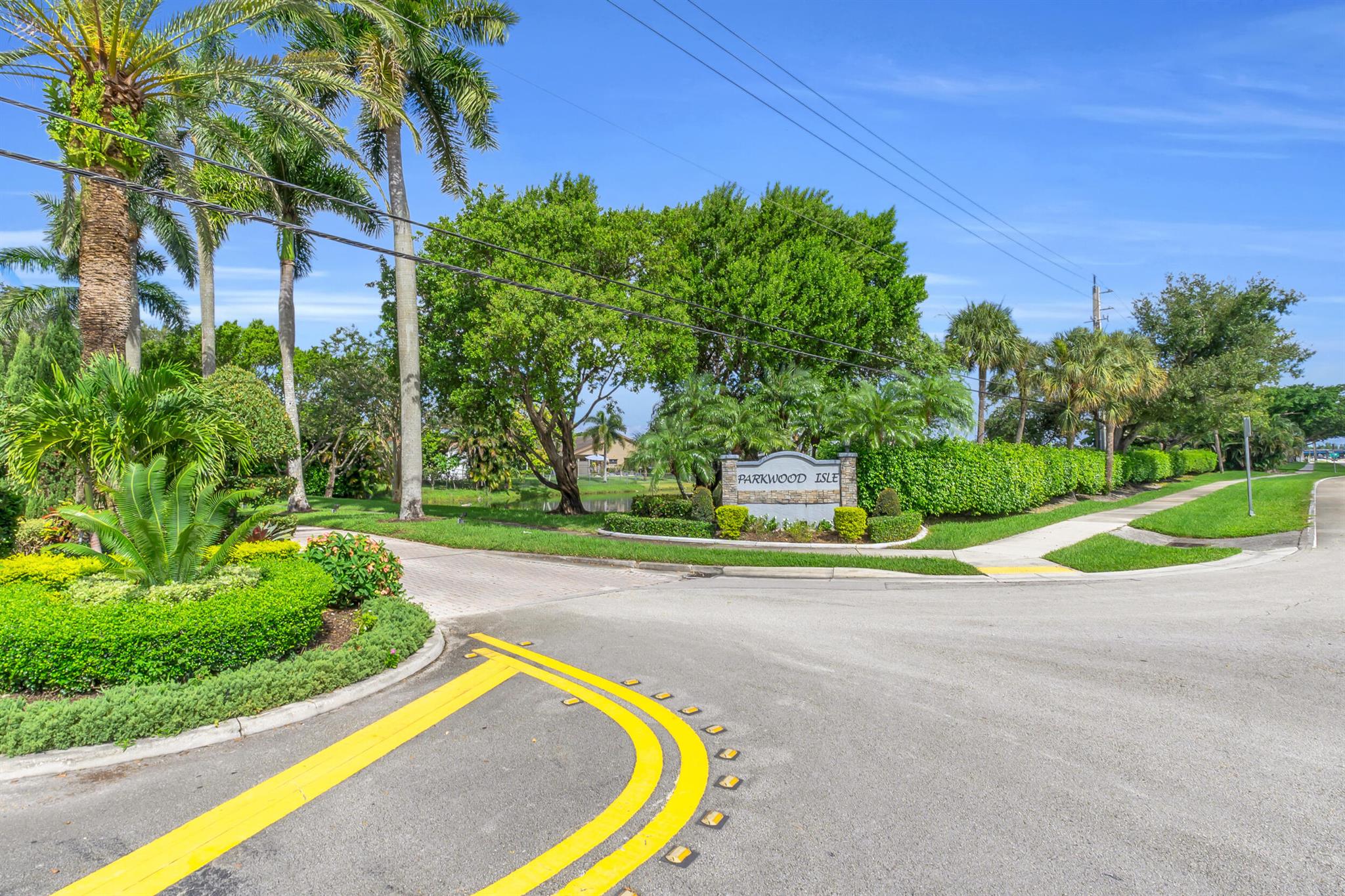 Welcome to Parkwood Isles--tropical waterfront living awaits in this beautifully maintained 3BR + den, 2.5BA pool home with 2,026 sq ft of space. Enjoy waterfront views and sunsets from your private fenced pool and patio, perfect for entertaining or relaxing. Inside, the open layout includes a versatile den for office or guest use, and a split-bedroom design with a generous primary suite featuring walk-in closet and ensuite bath. Added highlights: 2-car garage with raised laundry area. HOA is just $92/month with rental approval. Walking distance to Fox Trail Elementary (~0.5 mi) and Indian Ridge Middle (~0.3 mi), with police and fire services nearby. Minutes to I-595, FLL Airport, Sawgrass Mills, beaches, waterfront dining, and marinas--ideal for lifestyle or investment.