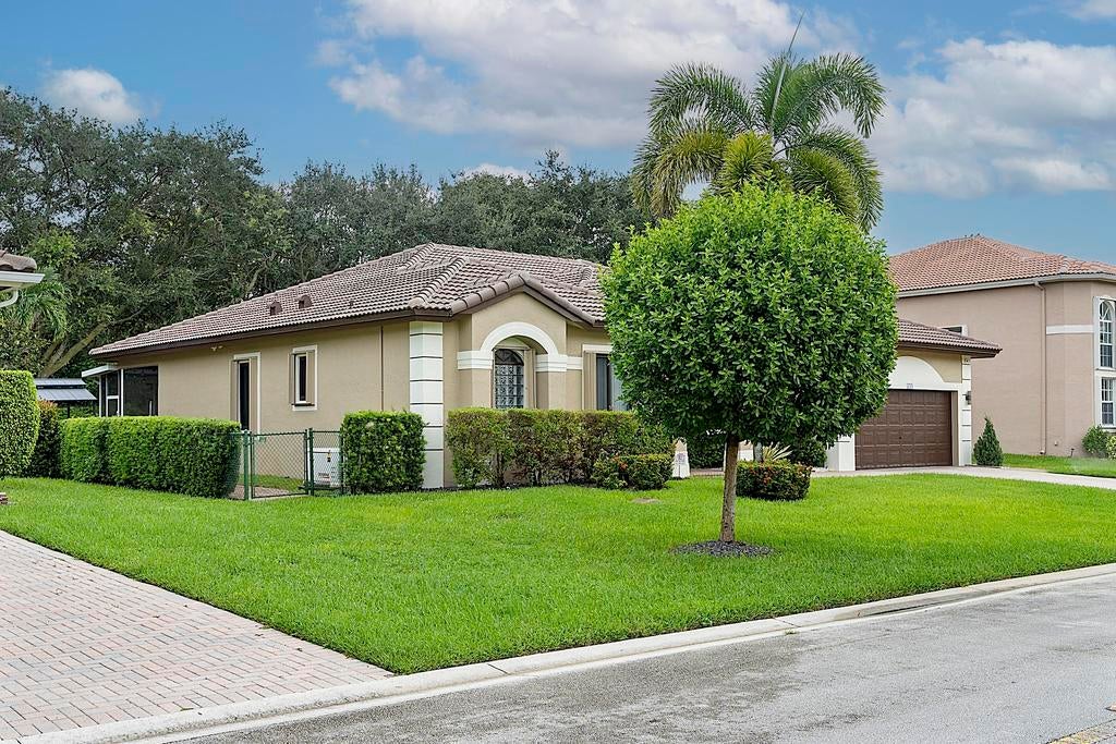 Photo of 5734 NW 50th Drive, Coral Springs, FL 33067 (MLS # B26075745)