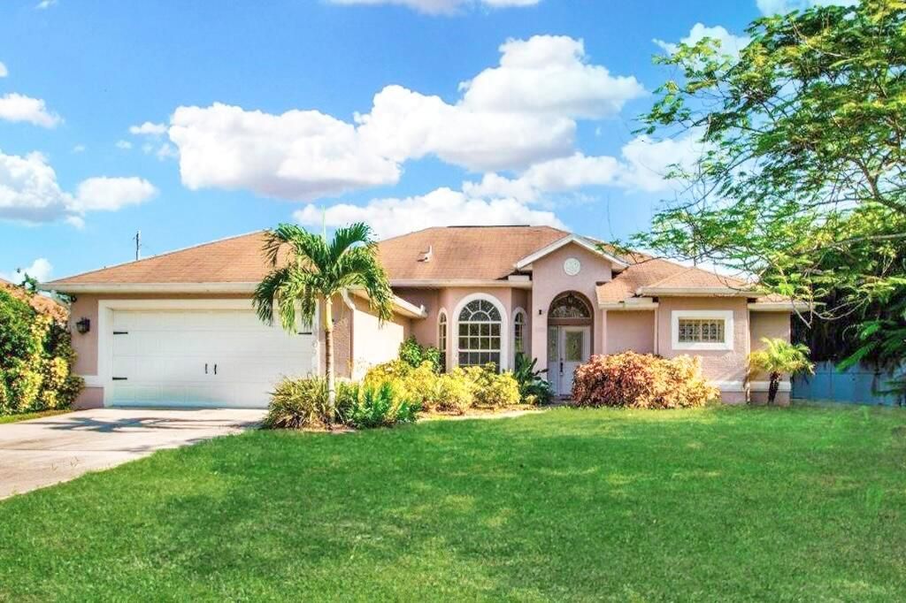 Photo of 1509 SW Crater Avenue, Port Saint Lucie, FL 34953 (MLS # R11013853)