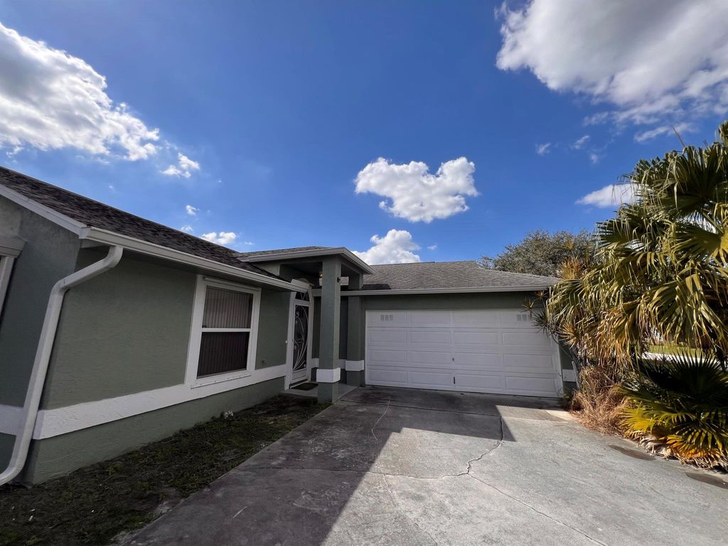 Photo of 1106 SW Gardena Avenue, Port Saint Lucie, FL 34953 (MLS # R11061088)