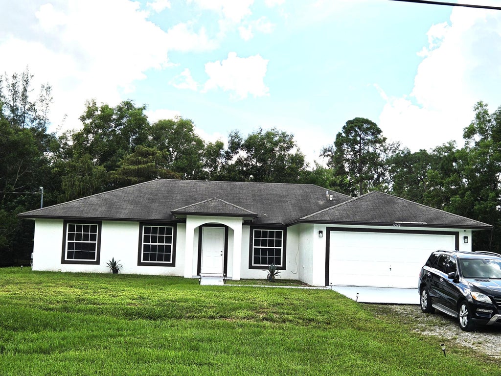Photo of 17148 30th Lane N, Loxahatchee, FL 33470 (MLS # B26086521)