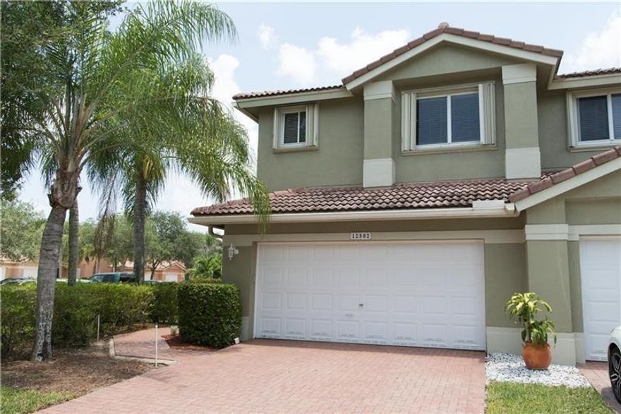 Move in Ready! Light, bright, and beautifully updated, this 3 bed, 2.5 bath townhome in The Fairways at Heron Bay offers stylish living on a desirable corner lot. Enjoy the warmth of wood floors throughout and the modern elegance of quartz countertops in the kitchen and bathrooms. The spacious layout includes a 2-car garage and plenty of natural light. Located in a gated, amenity-rich community with top-rated schools, parks, and golf nearby—this is South Florida living at its best! A rated Parkland Schools! Enjoy 2 clubhouses both with pools and this community also has its own pool.